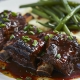 Short ribs served with mashed potatoes and green beans