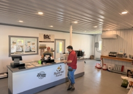 Inside Feed store Customer paying for feed