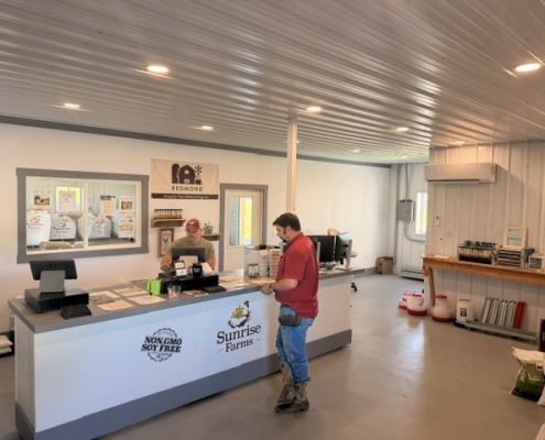 Inside Feed store Customer paying for feed